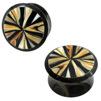 Load image into Gallery viewer, Two round black Horn Plugs with white shell inlay, hand-carved in a tribal pattern. The Buffalo Tunnel Ohrstecker features geometric, radial designs on the faces.
