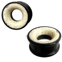 Cargar imagen en el visor de la galería, Two black, circular Eisenholz Tribal Plugs with a white Marmor inlay are shown against a white background—one Holztunnel is viewed from the side, the other at an angle. Hand-carved Tunnel schwarz Marmorinlay weiß Expander.
