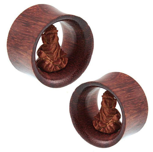 Two unisex wooden rings, each featuring a hand-carved Buddha Tunnel motif from the "Holz Tunnel braun hell dunkel Buddha sitzend Tribal Plug handgeschnitzt Expander Organic," are shown side by side on a white background.