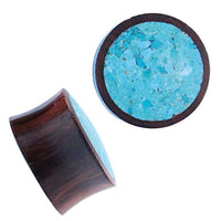 Load image into Gallery viewer, Two round Holz Plug Sonoholz Crushed Türkis Inlay double flared plugs, one on its side showing wood grain and inlay, the other with a top view of the turquoise-crushed surface. Ideal as stylish Tribal Expander jewelry.
