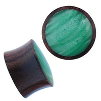 Cargar imagen en el visor de la galería, A pair of Holz Plug Sonoholz grün schillernd Resin Inlay double flared plugs, with dark brown wood sides and shimmering green resin inlay. One plug is viewed from the side, the other displays its marbled green face.
