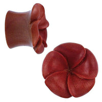 Load image into Gallery viewer, This hand-carved Tribal Holzplug Sawoholz Blume überlappend features a rich reddish-brown finish and a blooming five-petal flower design, shown from both the top and side views for natural beauty and warmth.
