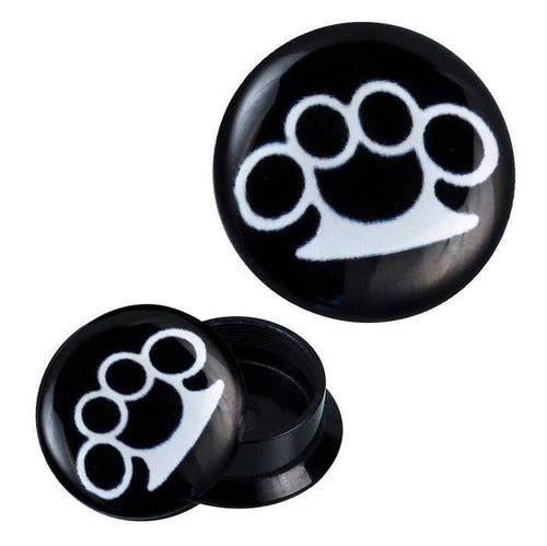 Two black Schraub Plug Acryl Schlagring Plugs feature a white brass knuckles design; one plug is closed, the other open to show the threaded interior.
