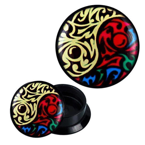 A pair of round, black Schraub Plug Acryl Yin Yang Tribals in vibrant yellow and multicolored abstract patterns—perfect ear jewelry for those who love unique, ornamental designs.