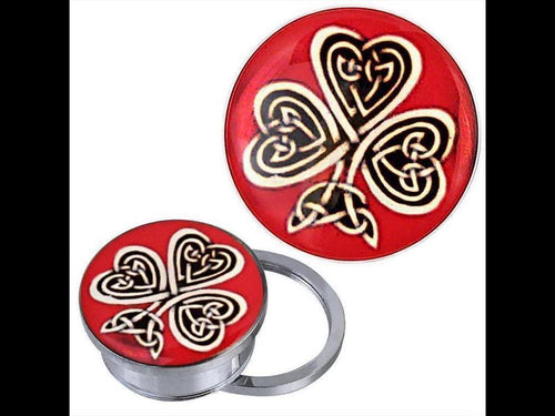 The Schraub Plug Tunnel silbern Edelstahl keltische Knoten Kleeblatt rot Acryl Piercing is a round metal phone grip with a red top, gold Kleeblatt motif, and Celtic knot design. Shown from top and side angles.