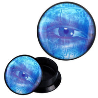 Load image into Gallery viewer, A round black Schraub Plug Acryl blau Auge Computer Zeichen Piercing Ohrschmuck with a lid showing a digital blue eye and circuit patterns, evoking tech and vision. The open container displays its empty inside.
