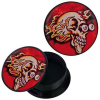 Load image into Gallery viewer, A round black Schraub Plug Acryl container, open to reveal its empty interior. Both the container and its removable lid display a flaming skull with red-yellow eyes on a red background. Ideal for piercing and Ohrschmuck.
