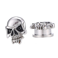 Load image into Gallery viewer, Two Edelstahl Tunnel Plug silber Farben Totenkopf Gebiss Skull Schraubplug dünn schwarz: metallic skull plugs with black accents, showing detailed teeth and cheekbones—one forward-facing, one showing top and side views.
