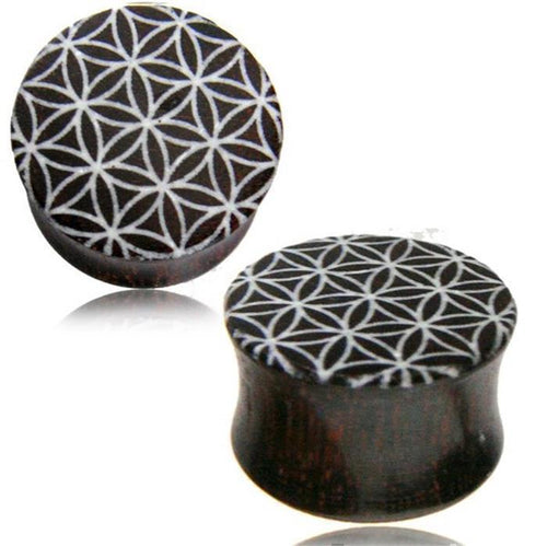 Two dark circular Holz Plug Tamarinde Bone Inlay Blume des Lebens handgeschnitzt Tribal Tunnel Expanders with a white geometric flower of life pattern are displayed on a white background, blending striking style and natural charm.