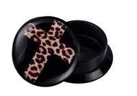 Load image into Gallery viewer, A round black Schraub Plug Acryl Kreuz Leoparden Design Piercing Ohrschmuck with a glossy leopard print cross on top, an angled cap revealing the threaded interior, shown against a white background.
