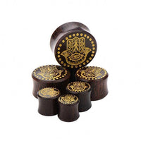 Load image into Gallery viewer, Six dark Holz Plug Poor Mans Hand Tamarind Khamsa Plugs with gold painted Fatima eye design, laser engraved dots, and tribal details, arranged on a white background.
