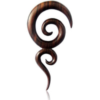 Cargar imagen en el visor de la galería, The Sonoholz lang Tribal Piercing Holz zwei Spiralen handmade features a dark wooden spiral pendant with curved, swirling shapes and a polished finish, making it a bold Organic Tribal Piercing ideal as Piercingschmuck Ohrloch on white background.
