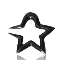 Load image into Gallery viewer, A glossy, black Tribal Buffalo Horn Piercing Expander in a rounded star shape rests on a white background, its smooth reflective surface and slight rightward tilt highlighting the stylish &quot;Stern rund Plug Ohrhänger Ohrstecker&quot; design.
