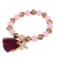 Load image into Gallery viewer, Armband Brass golden lila Quaste rosa Perlen Charm Elfe verstellbar
