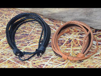 Load image into Gallery viewer, Leder Armband schwarz braun Schnüre verstellbar
