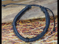 Load image into Gallery viewer, Leder Armband schwarz braun breit umwickelt verstellbar
