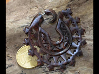 Load image into Gallery viewer, Fake Piercing Zackenrad Holz Edelstahl handgeschnitzt groß dunkelbraun Dehner
