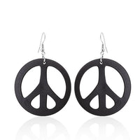 Cargar imagen en el visor de la galería, A pair of large, round, 50 mm Holzohrringe in a colorful peace design with stainless steel, nickel-free hooks are displayed against a white background.
