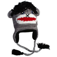 Load image into Gallery viewer, Unisex Tiergesicht Mütze: Norwegermütze im Sock Monkey-Stil mit Knopfaugen, roten Lippen, schwarzem Garnhaar, Ohrklappen und geflochtenen Quasten an den Seiten.
