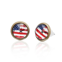 Load image into Gallery viewer, A pair of round, nickelfree Brass Ohrstecker (12 mm) with a colorful stars motif, unisex design, and stainless steel back—comfortable to wear.
