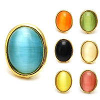 Load image into Gallery viewer, Seven colorful star-shaped unisex brass stud earrings, each in a different color—blue, orange, green, black, cream, yellow, and pink—displayed on a white background. Made of stainless steel and brass; 12 mm; nickelfrei for comfort.
