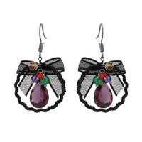 Load image into Gallery viewer, Brass Ohrringe silberfarben welliger Kreis Stoff schwarz bunte Steine
