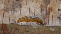Load image into Gallery viewer, Messing Armreif golden Mondstein Spirale Tropfen Flechtrand nickelfrei verstellbar antik Tribal

