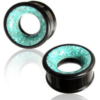 Load image into Gallery viewer, Two Holz Tunnel türkis schwarz crushed Stein Inlay Eisenholz plugs are shown, featuring a circular design with a Türkis crushed stone inlay and polished finish, displayed against a white background with a subtle reflection below.
