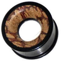 Cargar imagen en el visor de la galería, A close-up of the Holztunnel Eisenholz schwarz with a metallic outer edge and hand-carved Antikholzinlay that features a patterned, light brown tribal design and a large central hole.
