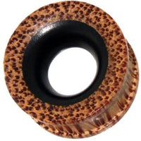 Load image into Gallery viewer, The Flesh ribbed Tunnel Eisenholz Kokosholz schwarz braun is a round ear plug with a black center, brown rim, and a spotted leopard-style design. This holztunnel plug has a hollow center and is angled for a unique look.
