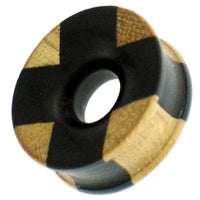 Load image into Gallery viewer, A small, round hand-carved tunnel plug made from ironwood and teak, featuring a black-brown cross pattern—perfect for adding Tribal Holz Tunnel style with the Holztunnel schwarz braun Kreuzmuster to your look.
