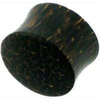 Cargar imagen en el visor de la galería, The Holzplug Palmenholz dunkelbraun schwarz mit Punktmuster ist ein handgeschnitzter Tribal Plug Tunnel Expander mit zylindrischer Form und ausgeprägter Maserung, ideal als Ear Gauge oder Body Jewelry.
