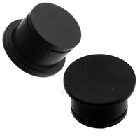 Cargar imagen en el visor de la galería, Two black, hand-carved Eisenholz Tribal Plug single flared tunnels with concave shape are shown against a white background.
