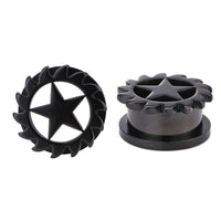 Load image into Gallery viewer, Two dark gray, lightly shiny Schraubplug Chirurgenstahl Tunnel Plugs made of thin stainless steel feature a central star and a jagged edge. One stands upright to show the front; the other lies flat to display the top view.
