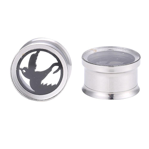 Two silver ear gauges: one with a flying dove cutout as the motiv Friedenstaube plug, the other shown from the side to display its sleek zylindrischer Tunnel shape. Both made from hochwertigem, silberfarbenem Edelstahl.