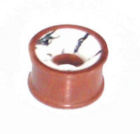 Cargar imagen en el visor de la galería, A small, round, brown Holz Tunnel Howlith plug made of hand-carved rosewood with a white marbled pattern and a central hole, resembling a miniature tribal expander or flesh tunnel.
