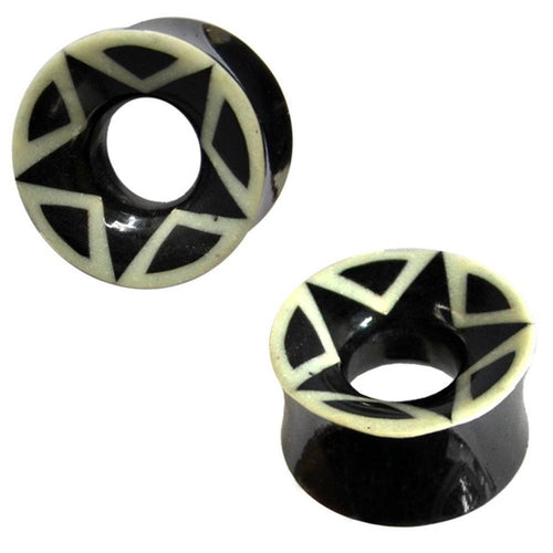 Two black and white Bio Stern Horn Plug Flesh Tunnels feature star-like geometric designs around the edges and a hollow center—ideal as organic expanders for a stylish, tribal-inspired piercing look.