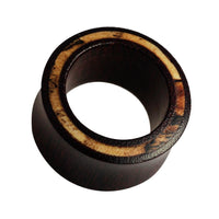 Load image into Gallery viewer, The Holz Flesh Tunnel Inlay Tamarinden Holz braun hell Plug is a double flared, hand-carved organic wooden ear plug with a light textured inner rim, shown on a white background.
