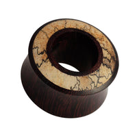 Load image into Gallery viewer, The Holz Flesh Tunnel Inlay Tamarinden Holz braun hell Plug is a double-flared, hand-carved organic ear plug with a polished dark brown body and light inlay featuring natural dark lines for a unique look.

