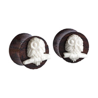 Load image into Gallery viewer, The Sonoholz Plug features a bone inlay of a white owl carved on a branch, creating a distinctive Tribal Tunnel Expander look.

