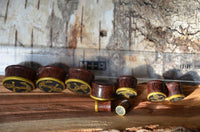 Load image into Gallery viewer, Plug Holz Tamarinde dunkelbraun Anker Seil Brass Überzug golden Rand Piercing
