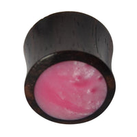 Cargar imagen en el visor de la galería, The Holz Plug Sonoholz features a dark wooden double-flared design with a smooth, slightly domed, shimmering pink resin inlay, shown against a white background.
