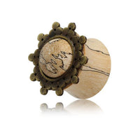 Load image into Gallery viewer, The Holz Plug Tamarinde Punkte Dreiecke Afghan Style Brass gold is a decorative beige and brown wine stopper with a round, ornate metallic top featuring a natural stone pattern and brass inlay, shown against a white background.
