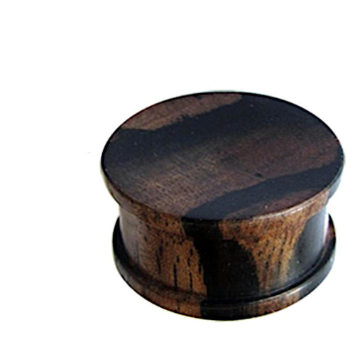 The Tigerholz Plug dunkelbraun schwarz Holzplug ribbed is a round, dark brown and black wooden ear gauge with ribbed detail, shown against a white background.