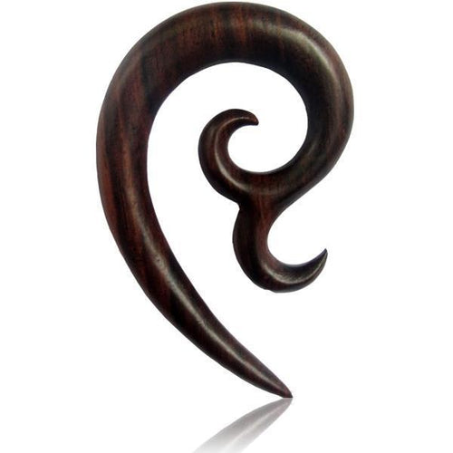 The Sonoholz Tribal Piercing Holz Bogen Bögen Unisex Expander is a hand-carved, dark wood ear gauge with a smooth, curved hook shape and pointed tip, featuring an organic, tribal-inspired design set against a white background.