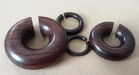 Load image into Gallery viewer, Piercing Narraholz Holz Expander dunkelbraun groß Ohrstecker Ring Bogen Dehner
