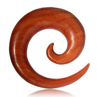 Load image into Gallery viewer, The Rosenholz Dehnschnecke Spirale Ohr Piercing rotbraun features a polished, spiral wooden design in rich reddish-brown, creating a striking organic look against a white background.
