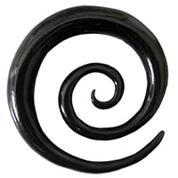 Load image into Gallery viewer, A glossy black Tribal Buffalo Horn Piercing XL-Spiral Plug Expander Ohrhänger Ohrstecker, resembling a stylized swirl or coil, stands out against a crisp white background.
