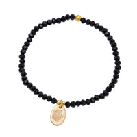 Cargar imagen en el visor de la galería, Perlenarmband Brass golden schwarz facettiert oval Krone Charm verstellbar
