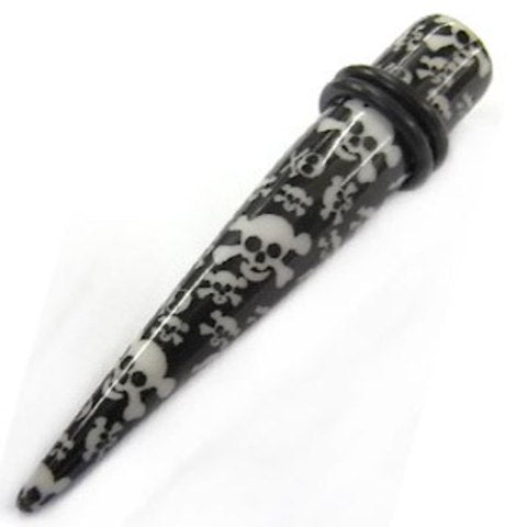 The Totenkopf Piercing Expander Dehnungsstab is a black ear stretcher with a white skull and crossbones design, two black rubber O-rings, and is the perfect unisex Ohrschmuck or unique Tunnel Plug for stylish stretching.